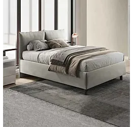 letto grigio con cuscini