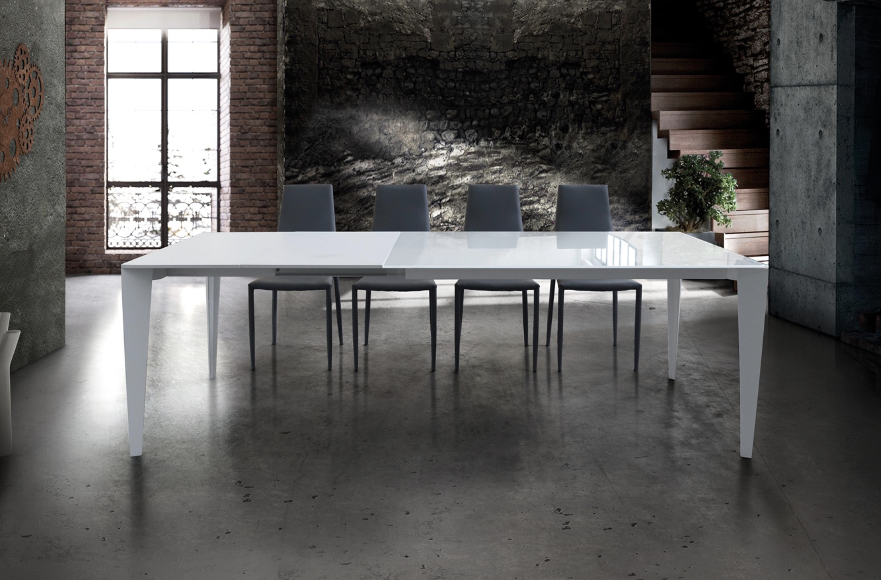 Tavolo in vetro con 2 allunghe da 40 cm.